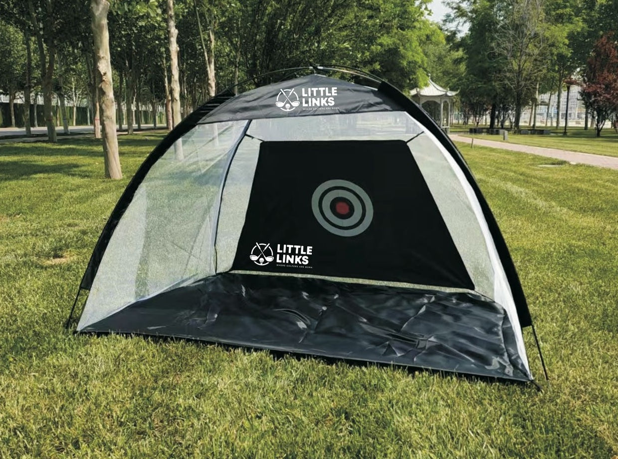 Little Links kids golf hitting net set up outdoors on grass, featuring a built-in target for practice, ideal for helping young golfers improve accuracy, confidence, and swing skills at home or in the backyard.