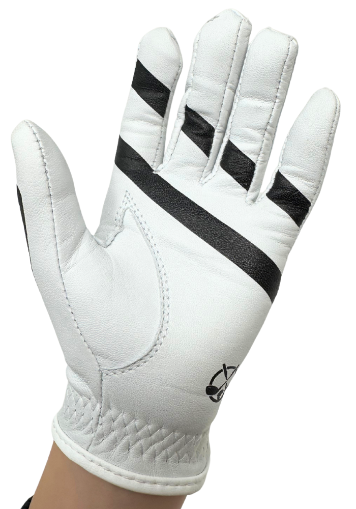 Little Links kids golf training glove for left hand shown in palm view on a child’s hand, highlighting grip alignment guides, palm padding, and stitching details designed to help young golfers develop proper hand placement, control, and confidence while practicing their swing.