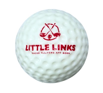 Close-up of Little Links kids foam golf ball in white with red logo, showing soft texture and oversized design ideal for beginner golf practice.